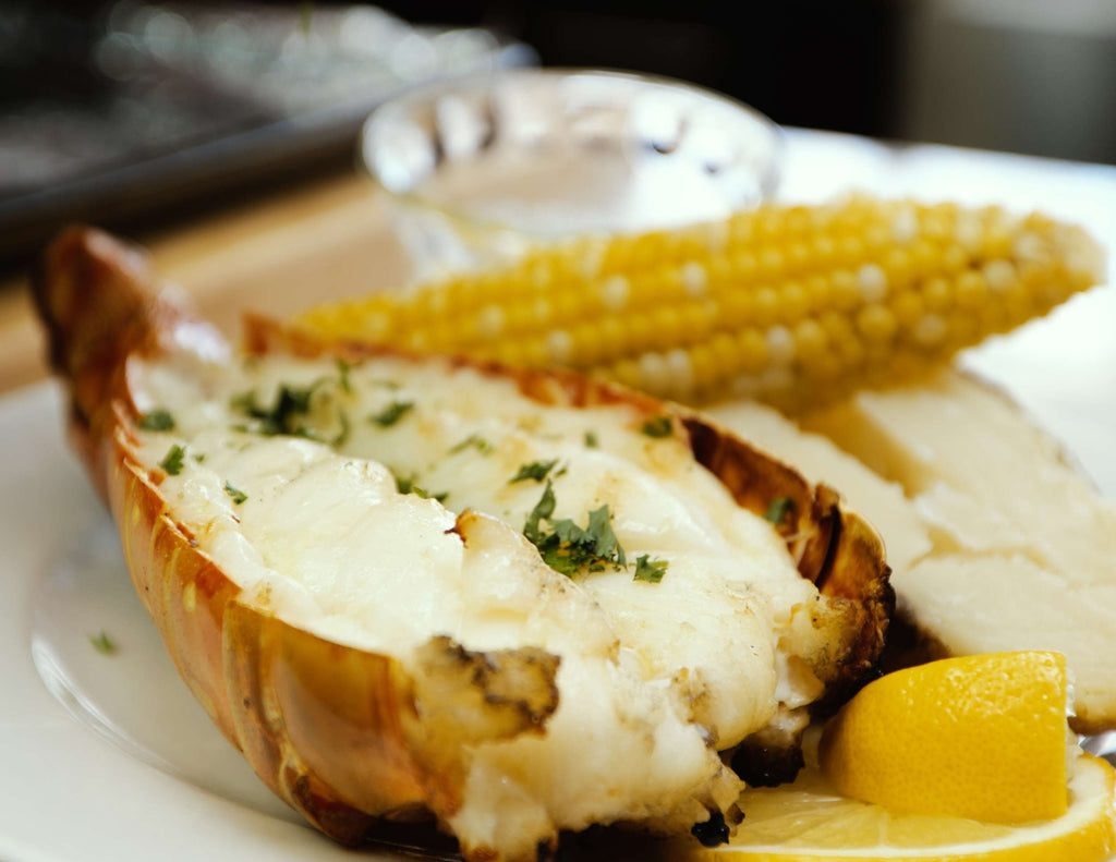 Sealand BBQ lobster tail with corn and potatoes