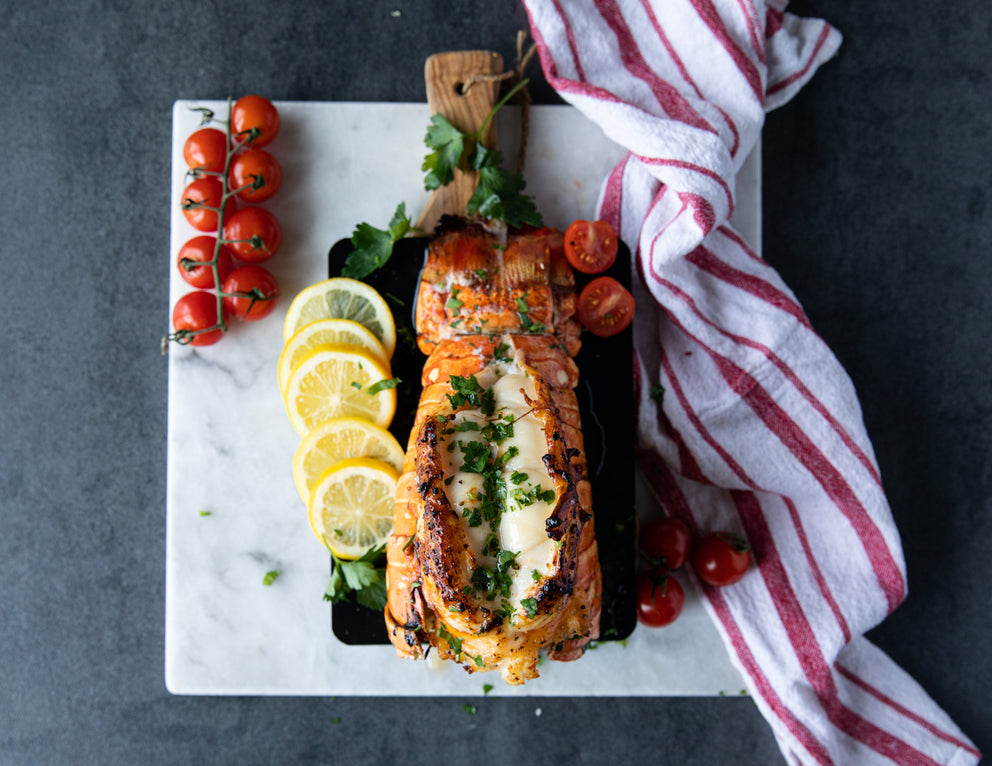 Sealand's Warm Water Lobster Tail Baked in Shell and Topped with Fresh Herbs