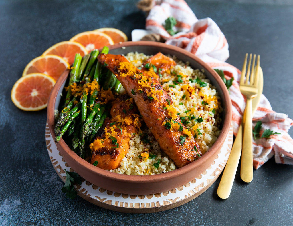 Moroccan spiced salmon fillets over a bed of rice with asparagus 