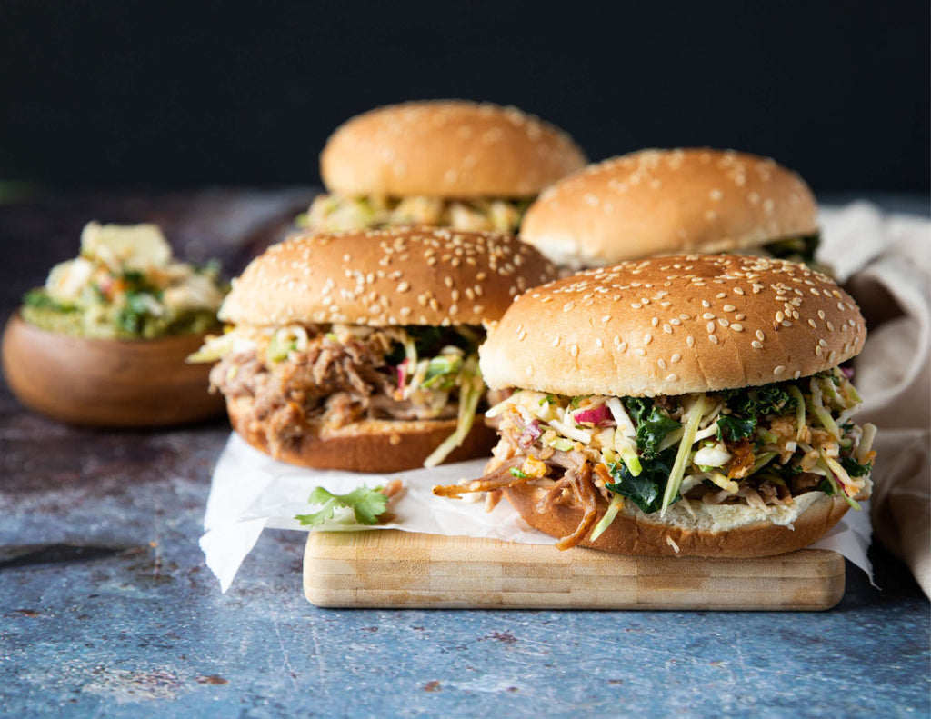 Sealand pulled pork with crunchy kale slaw in buns on a cutting board