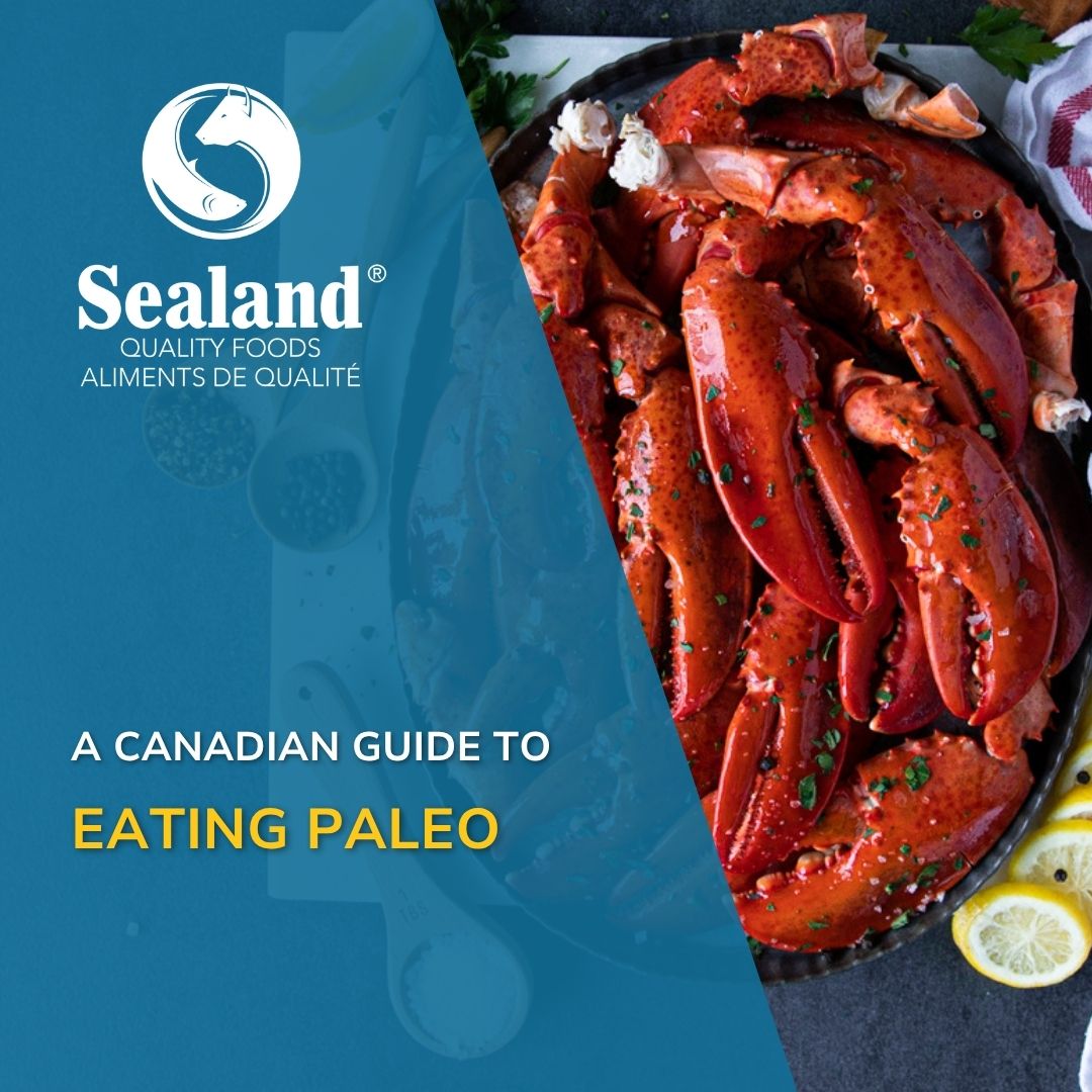 Sealand Quality Foods branded graphic featuring a platter of cooked lobster claws garnished with fresh herbs and served alongside lemon wedges, with the text "A Canadian Guide to Eating Paleo" overlaid on a teal background.