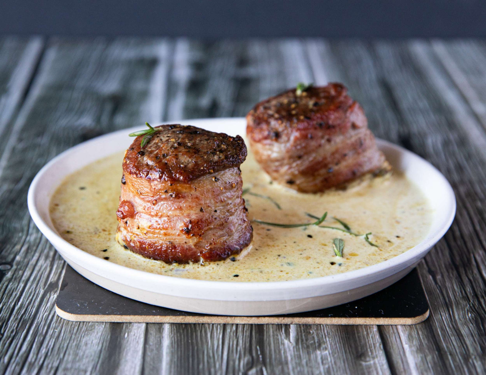 Sealand bacon wrapped tenderloin steaks with a creamy peppercorn sauce