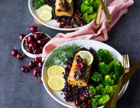 Mahi Mahi fillets with cherry dill caper salsa, broccoli and lemon slices