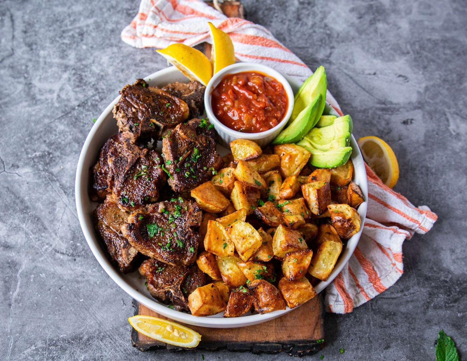 Sealand stove top lamb chops with salsa, roast potatoes and fresh avocado