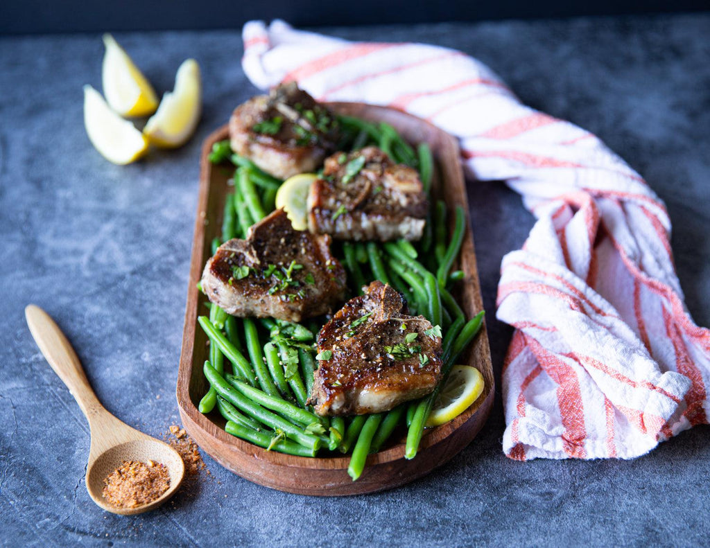 Sealand lamb chops with white wine sauce on a bed of green beans