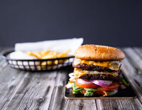 Stacked cheeseburger made with Sealand Quality Foods Gluten-Free Premium Prime Rib Burgers