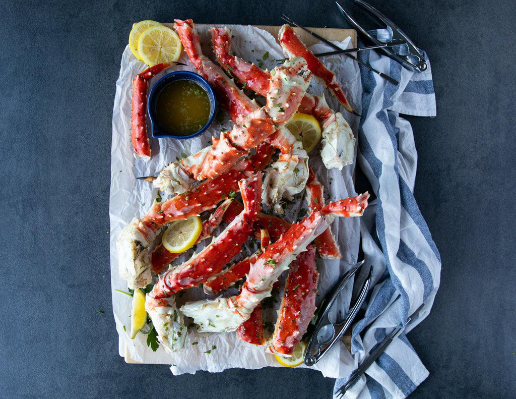 Sealand Quality Foods Colossal King Crab Legs served with lemon and butter