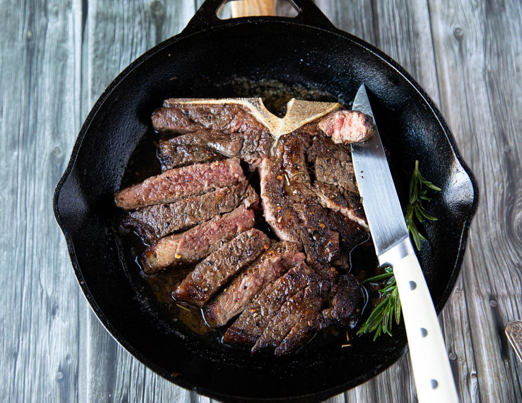 Sliced T-Bone Steak by Sealand Quality Foods in cast iron pan 