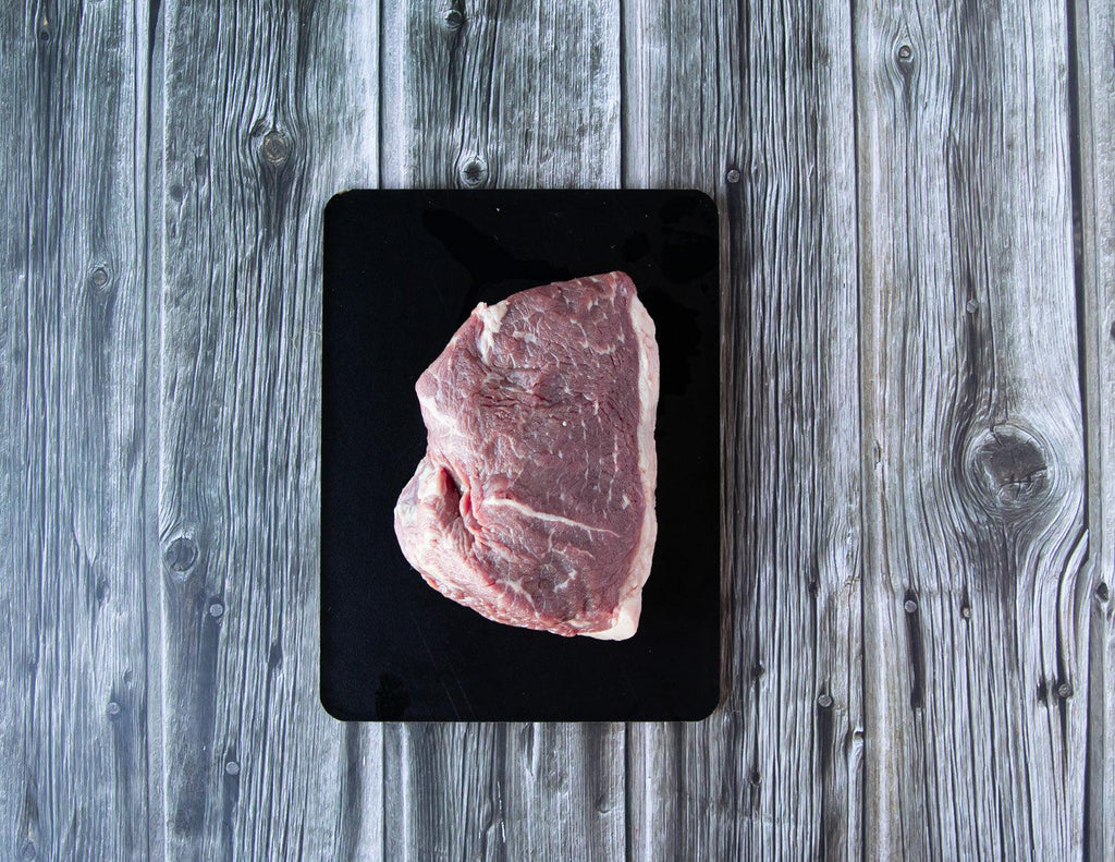 A raw 12oz Top Sirloin Baseball Steak from Sealand Quality Foods.