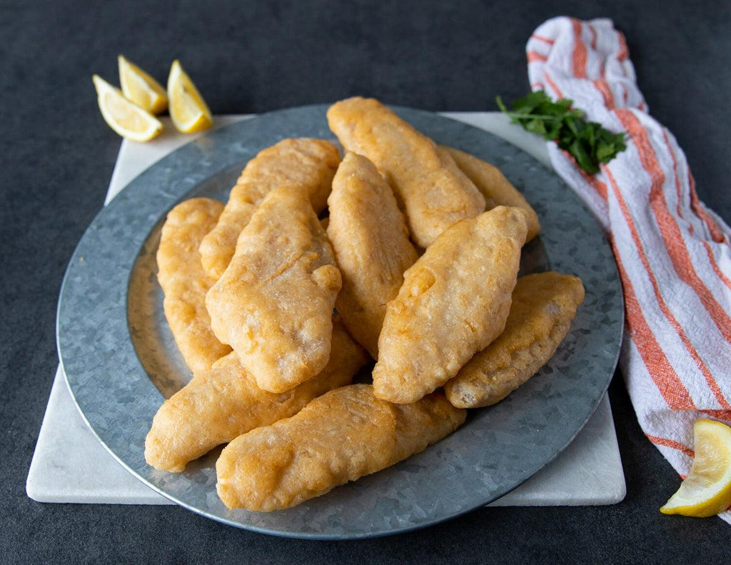 Uncooked Battered Haddock Fillets from Sealand Quality Foods.