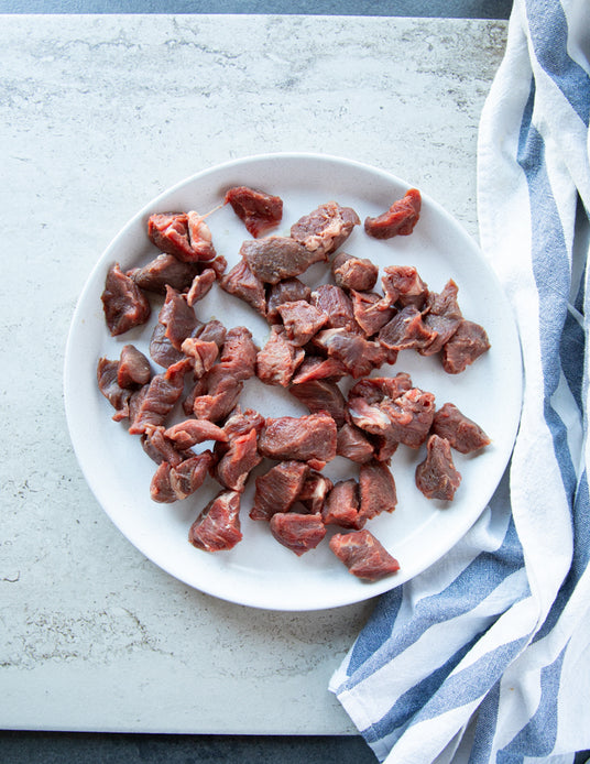 Plate with Raw Pieces of Sealand Quality Foods Beef Tenderloin Tips