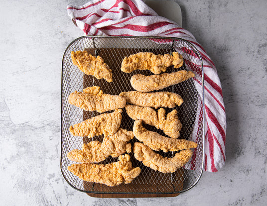 Sealand's Frozen Breaded Chicken Fingers in an Air Fryer Basket