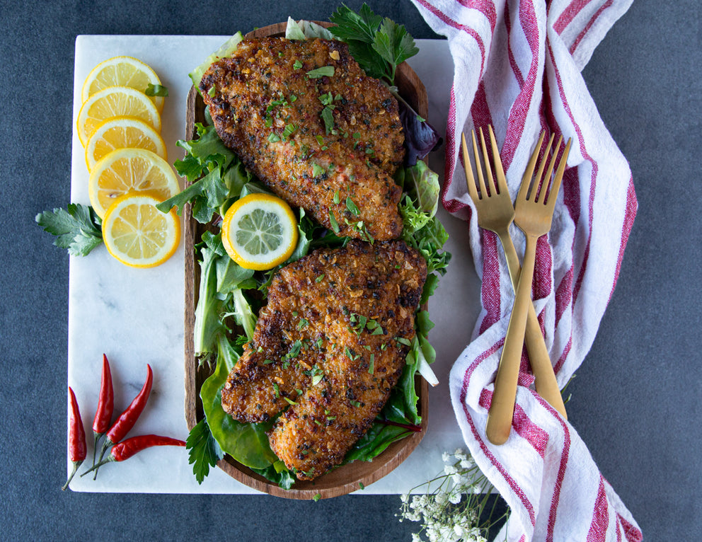 Sealand's Caribbean Crusted Tilapia Fillets Cooked and Served on a Bed of Greens