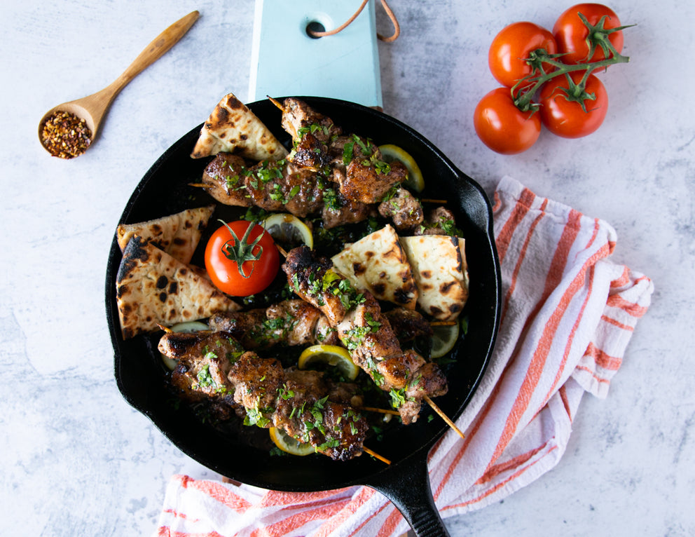Sealand's Chicken Kebab Skewers Cooked in a Cast Iron Pan with Pita and Tomatoes