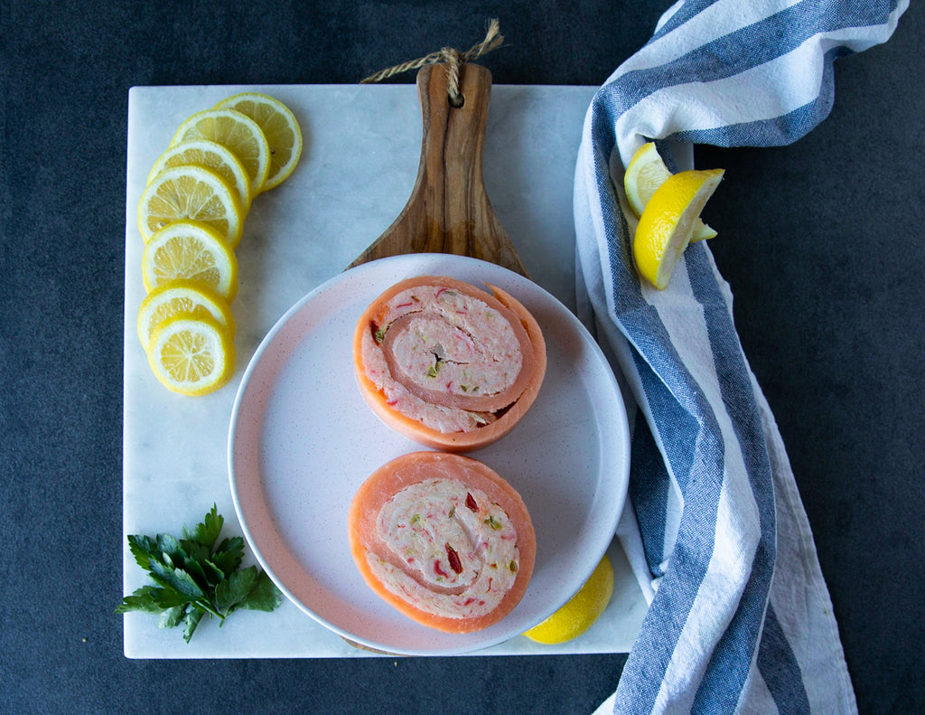 Two Frozen Sealand Crab Stuffed Salmon Pinwheels on a Plate