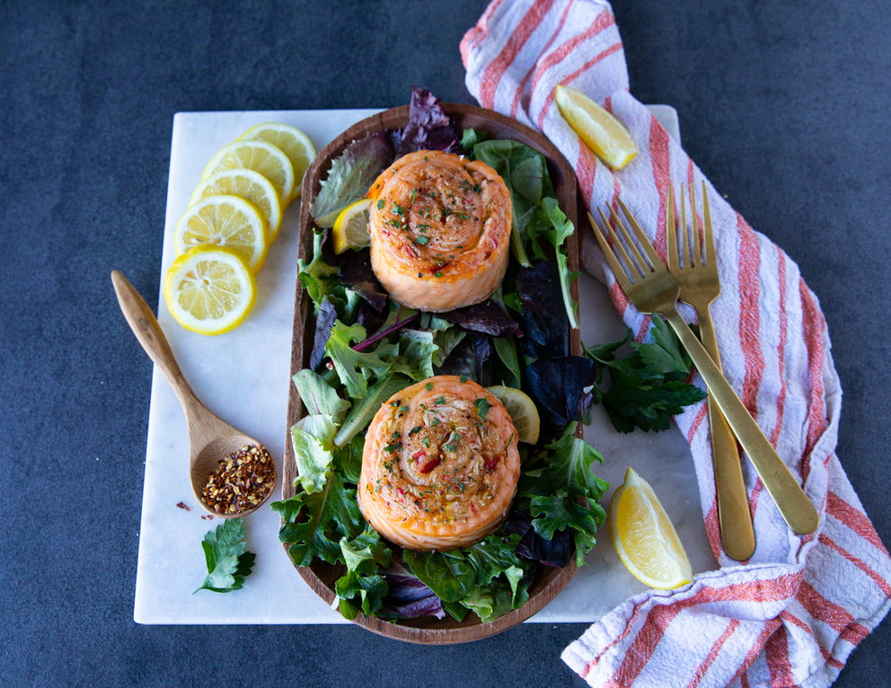 Cooked Crab Stuffed Salmon Pinwheels on Greens