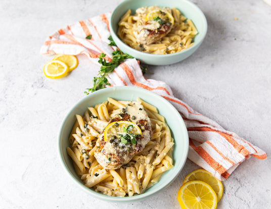 Creamy Lemon Chicken Over Pasta Served in Bowls