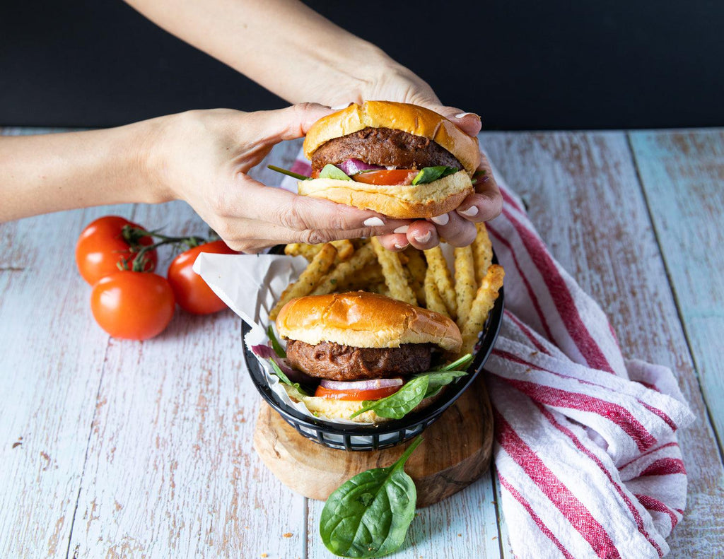 Sealand Quality Foods Gluten Free Beyond Meat Vegetarian Burgers in a Basket with French Fries