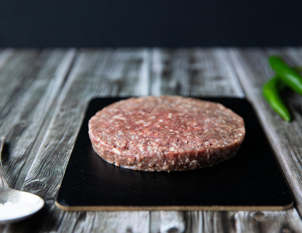 A raw Gluten-Free Bison Burger from Sealand Quality Foods.