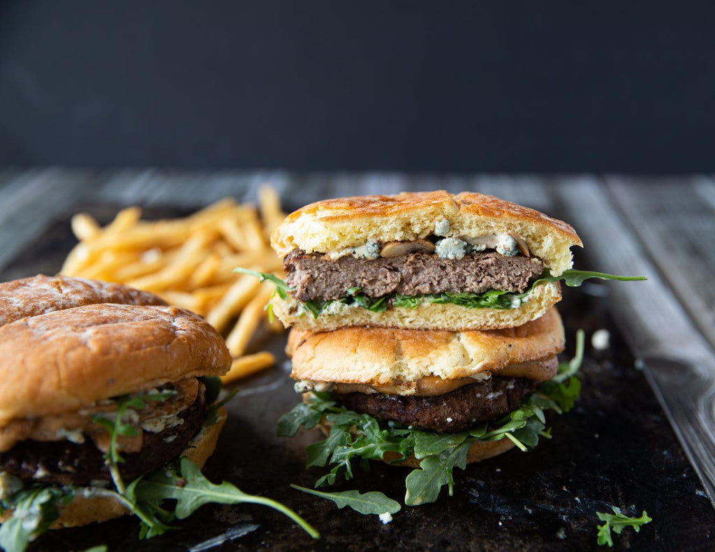 Stacked Gluten-Free Bison Burgers from Sealand Quality Foods.