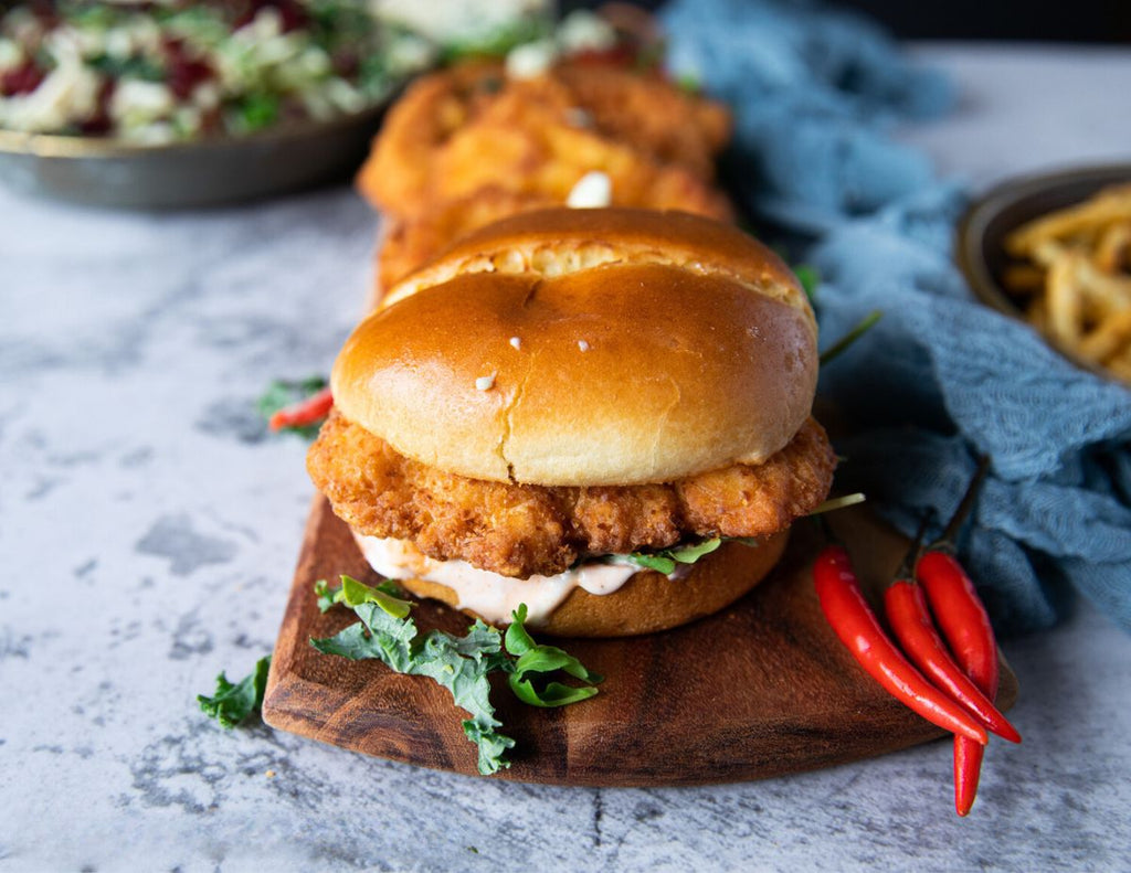Sealand Quality Foods Gluten-Free Breaded Chicken Burgers with chili peppers.