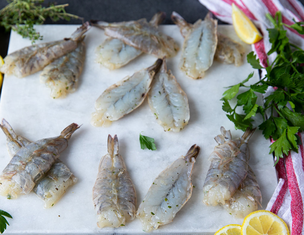Raw Herb and Garlic Butterfly Shrimp Prepared by Sealand Quality Foods