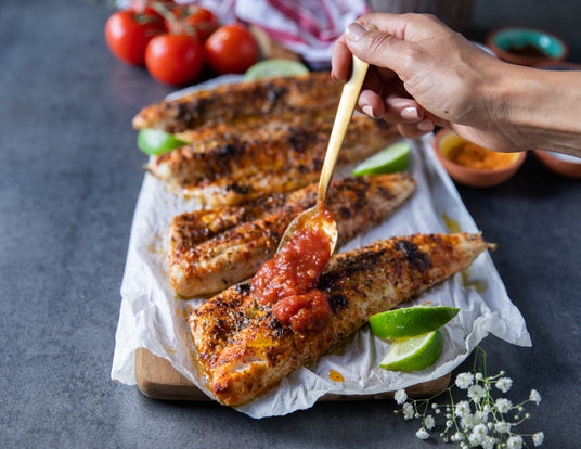 Sealand Quality Foods Pickerel Fillets Being Drizzled with Salsa