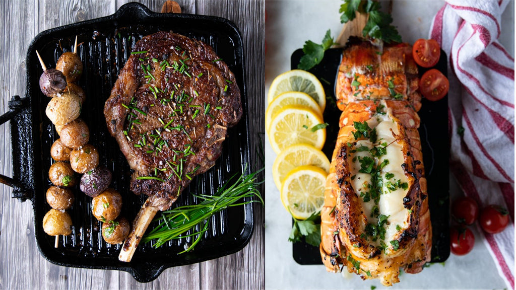 From the left, a Prime RIb steak in a cast iron skillet with potatoes and chives; on the right is a Lobster Tail with tomatoes and lemon slices.