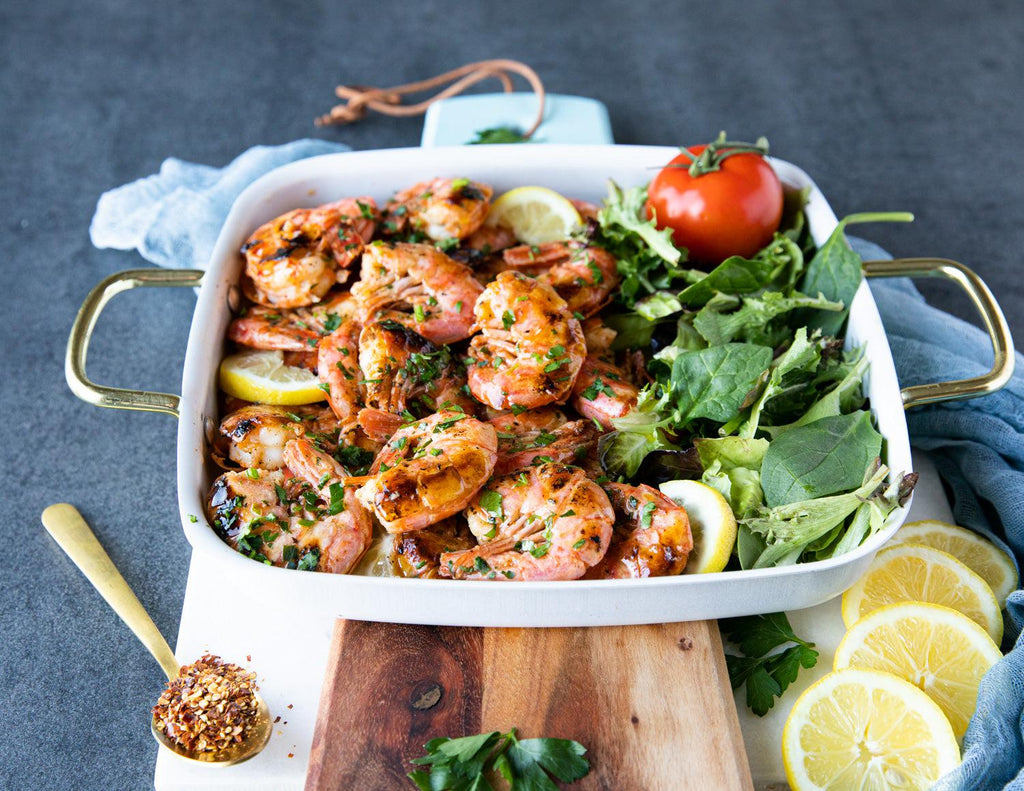 Sealand's cooked Red Raw Wild Argentinian Shrimp served with a side of spring mix greens.