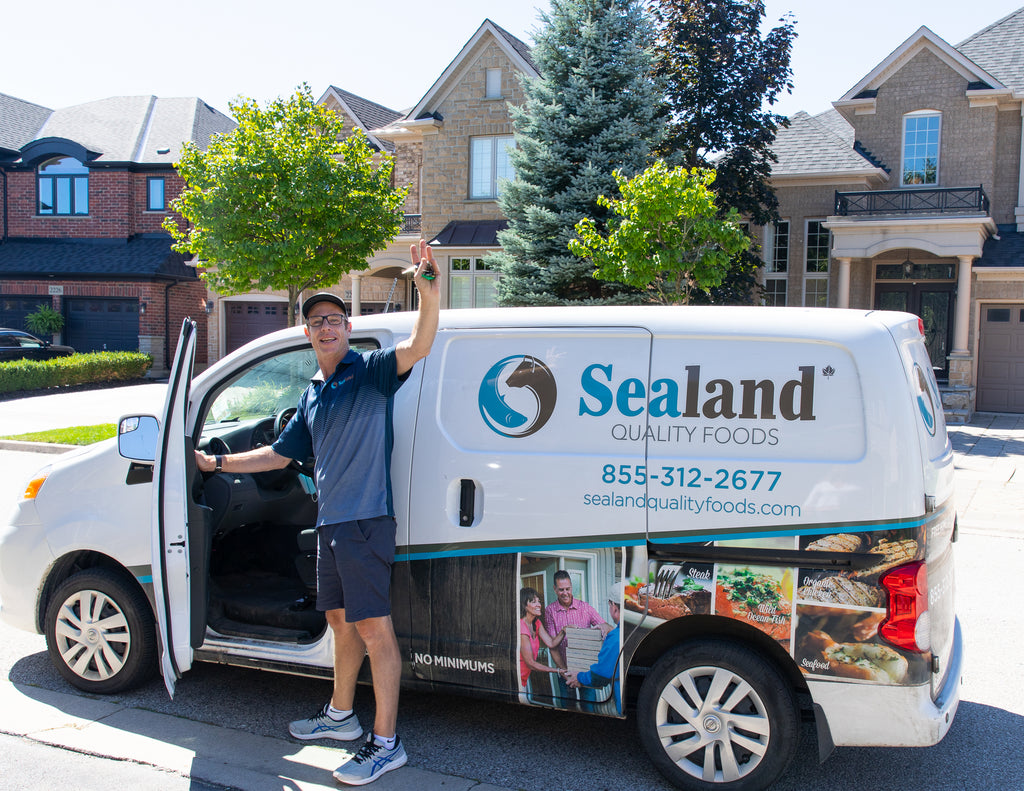 Sealand Quality Foods Delivery Driver Waving Outside of the Freezer Van