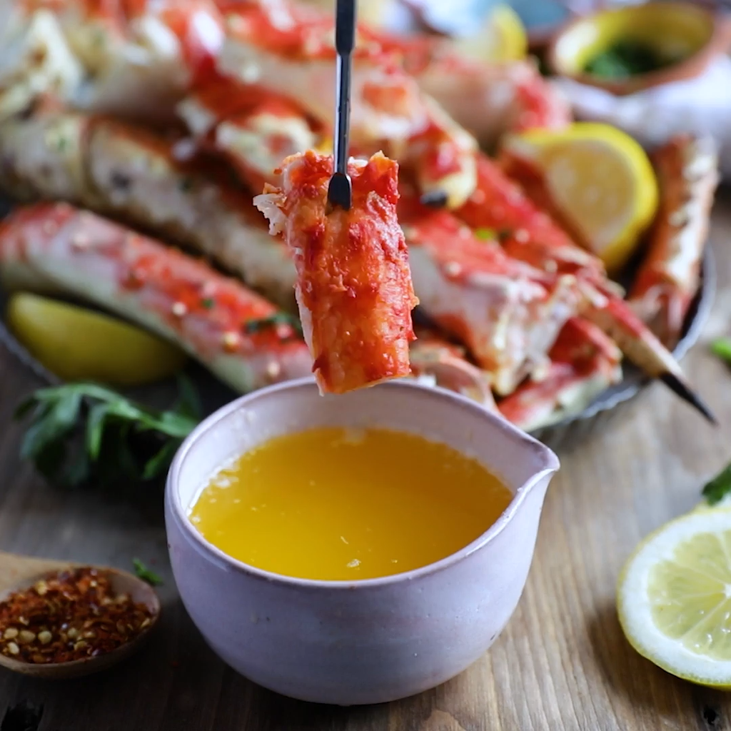 Dipping Sealands' Alaskan King Crab Legs in Melted Butter