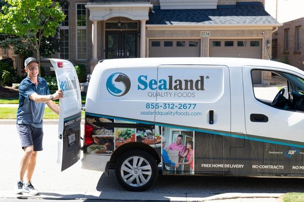 Sealand Culinary Consultant delivering boxes of Sealand products from delivery van