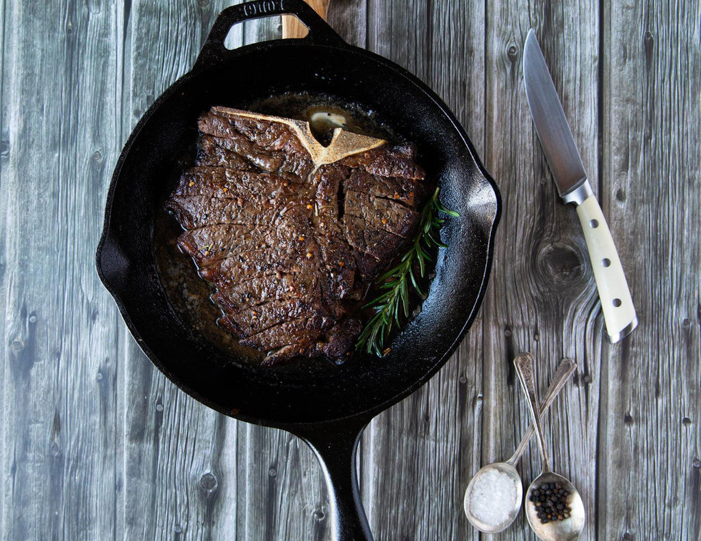 Sealand's T-Bone Steak in a cast iron skillet.
