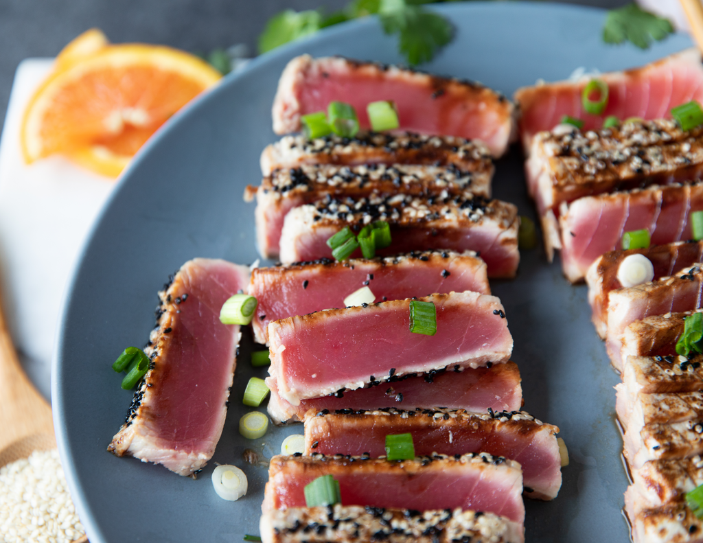 Sealand's Tuna Saku Blocks coated in sesame seeds and sprinkled with scallions.